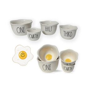 NWT Rae Dunn egg shaped themed measuring cups with “egg yellow” interiors